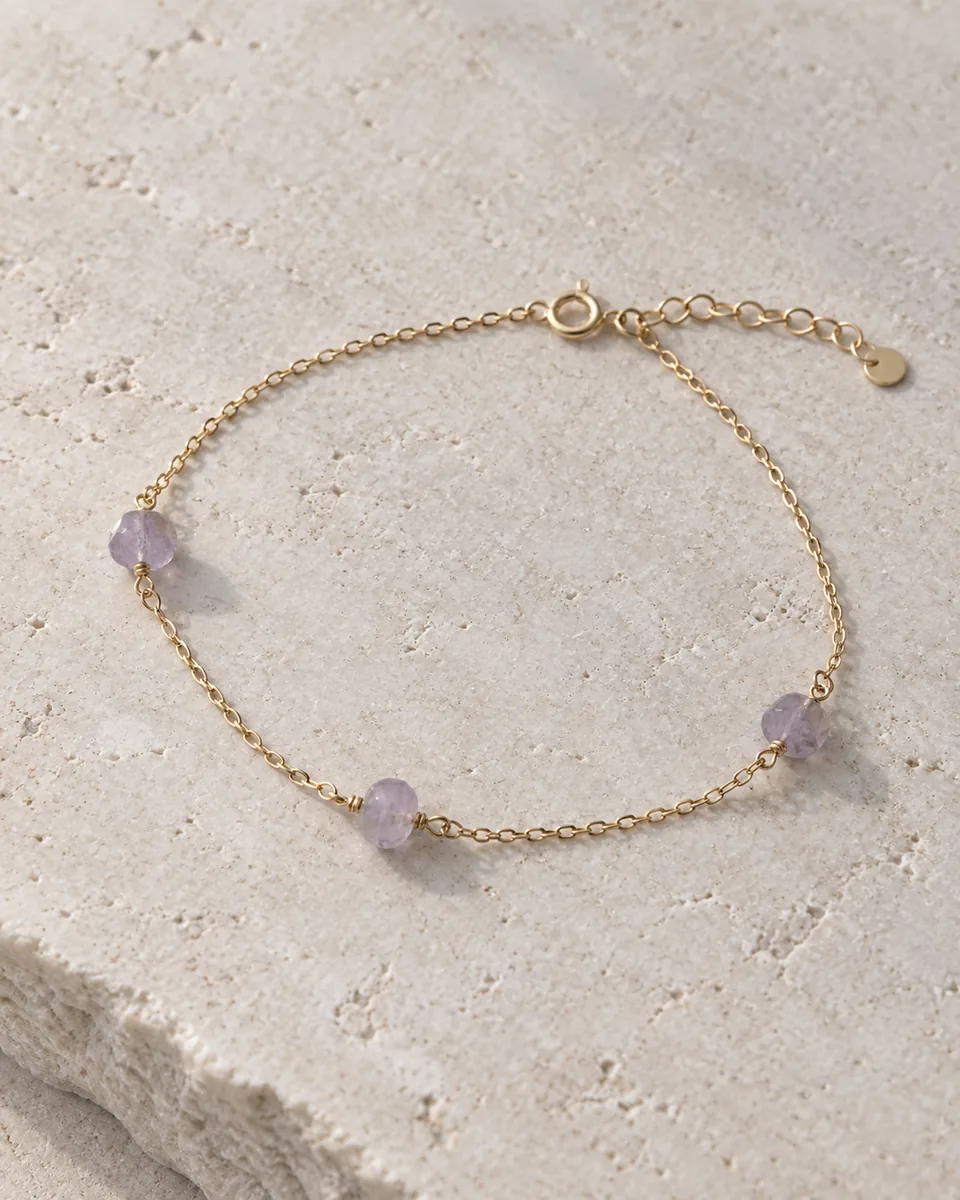 Concept: fine gold-tone bracelet with soft lavender gemstones